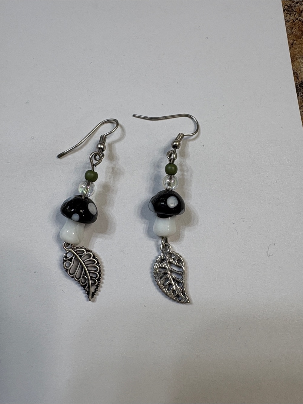 Spencer's Black & White Mushroom Leaf Dangle Earrings with Green Accent